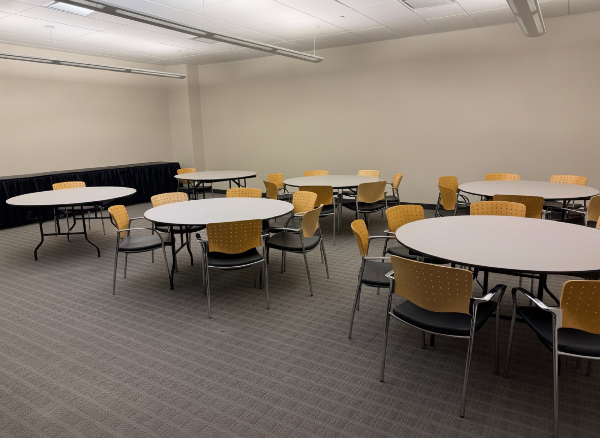 A room set with round banquet tables