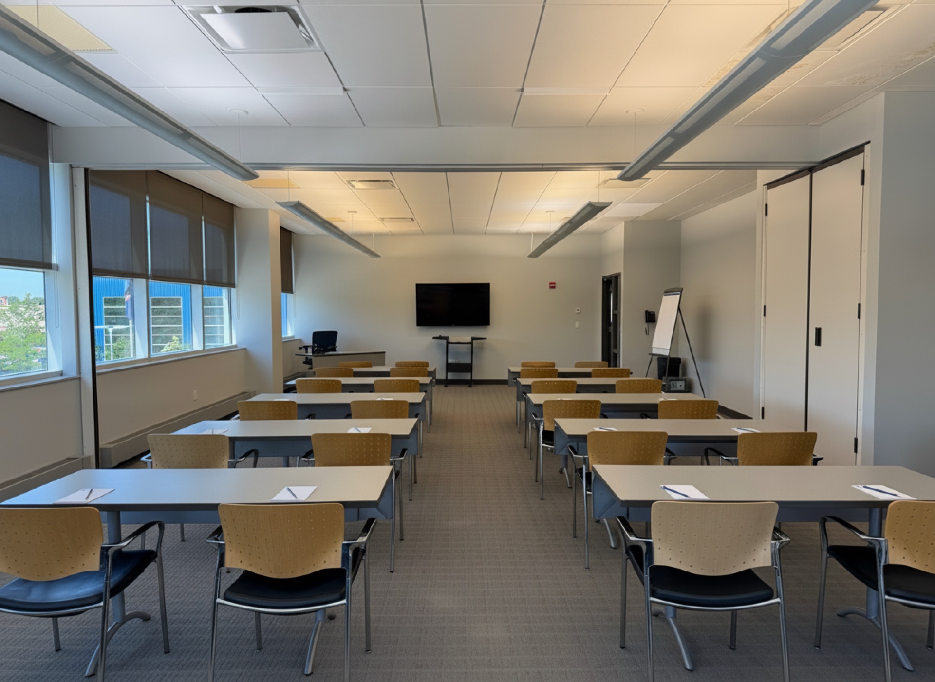 A workshop room with a flip chart and screen