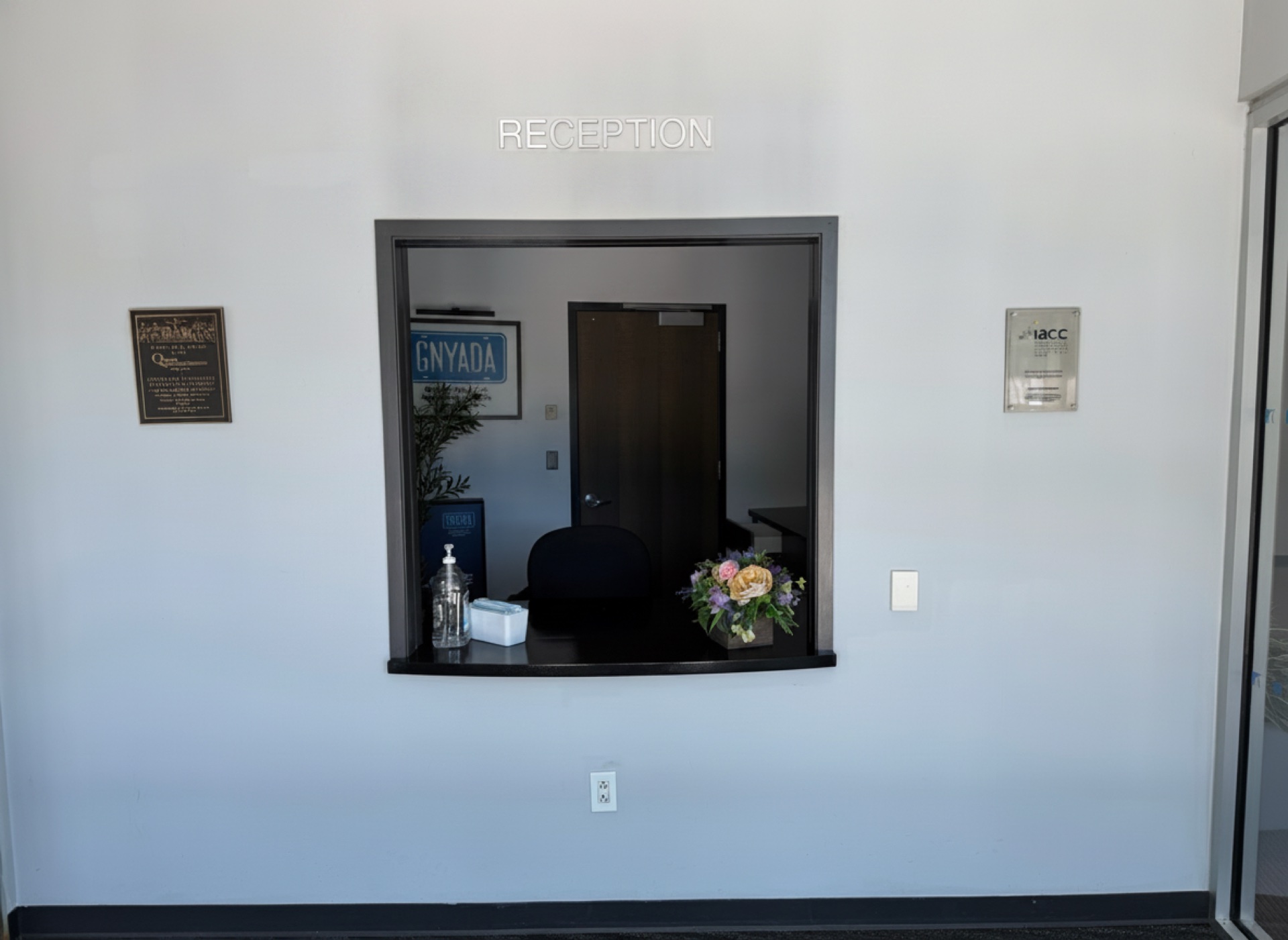 The reception window and plaques